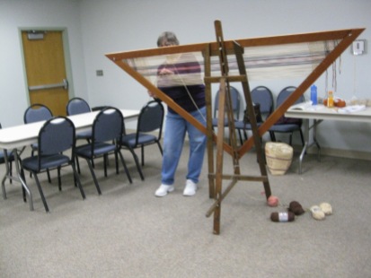 Teresa worked on her triangular loom