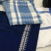 Members' plaid wrap and other woven pieces purchased in Mexico