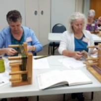 Kathy and Laura working with Inkle looms